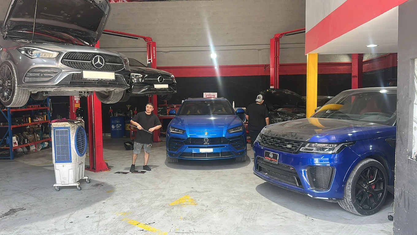 Alpha Prime Garage workshop in Umm Ramool, Dubai — cars on lifts